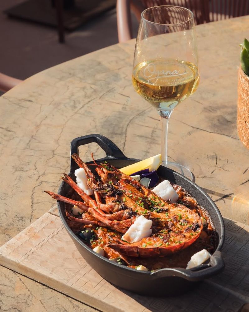 Lobster creamy rice served in a cast-iron pan